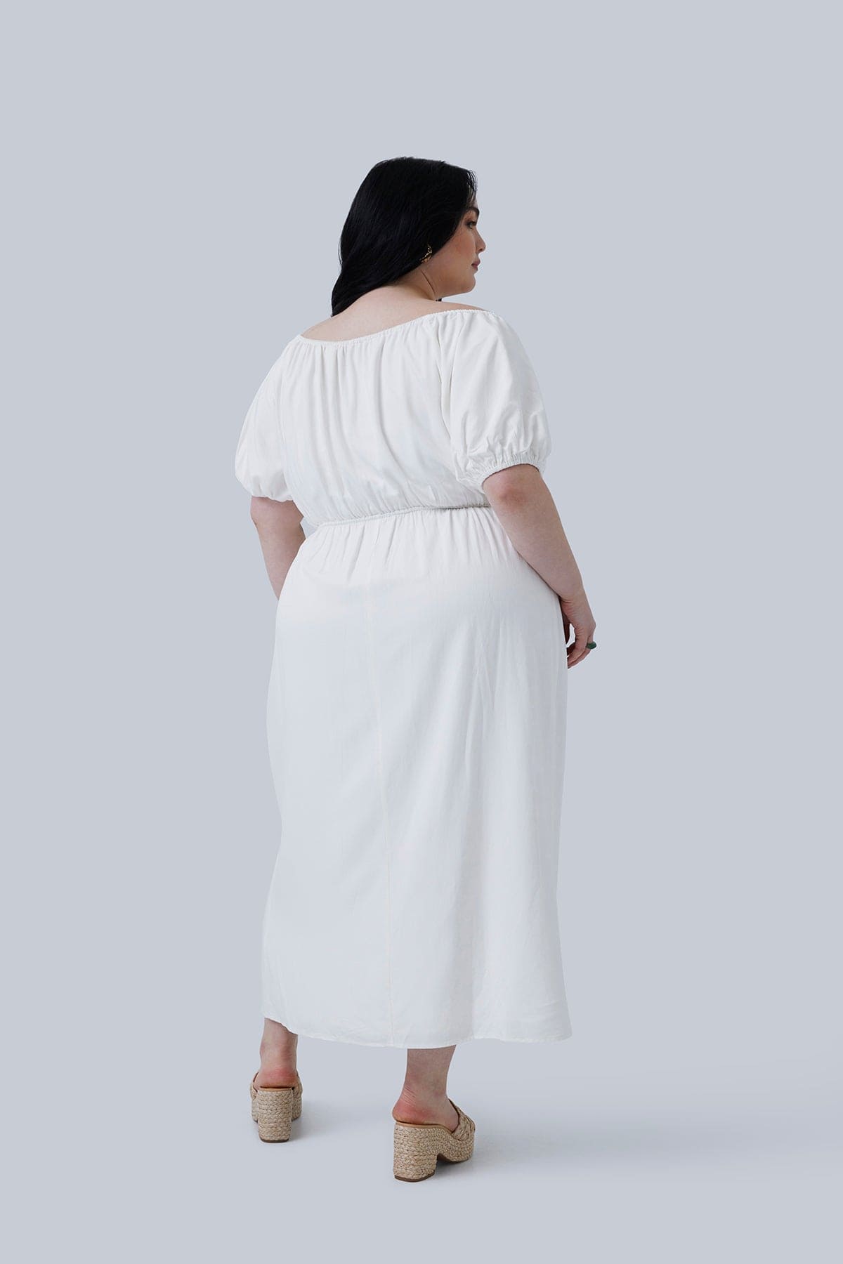 Back view of the Gia Midi Dress size 3X. This plus size travel dress for women is available in size 12-26. This is the perfect length for a dress. Shop Gia IRL Plus Size boutique.