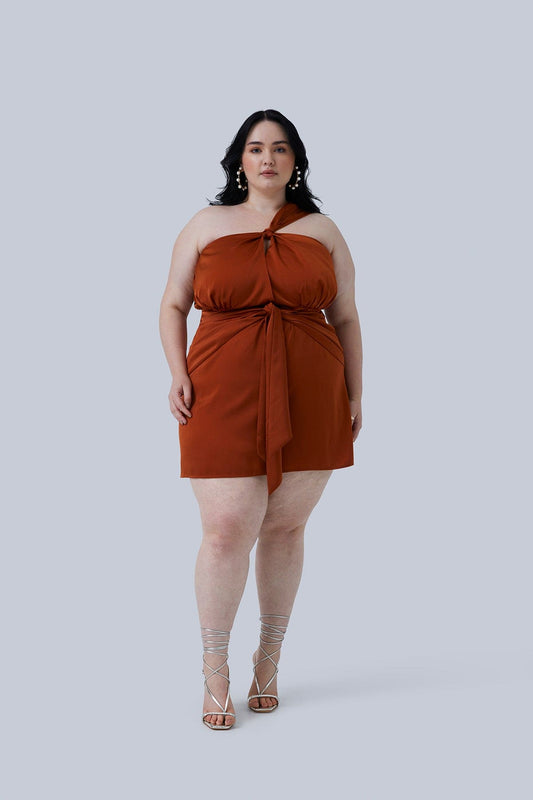 Front shot of the Maya Mini Dress Size 18 Plus Size Fashion for Women. Dress ties over one shoulder and ties in the front. Color is rust and fabric is silk.